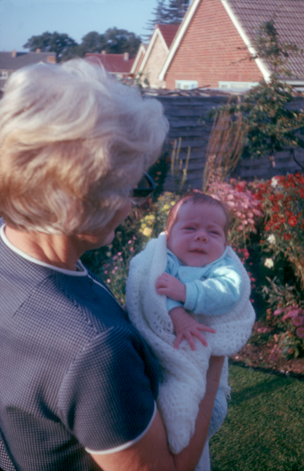 6501006k September 1965 - Mum with Jonathan in the garden at Yateley.