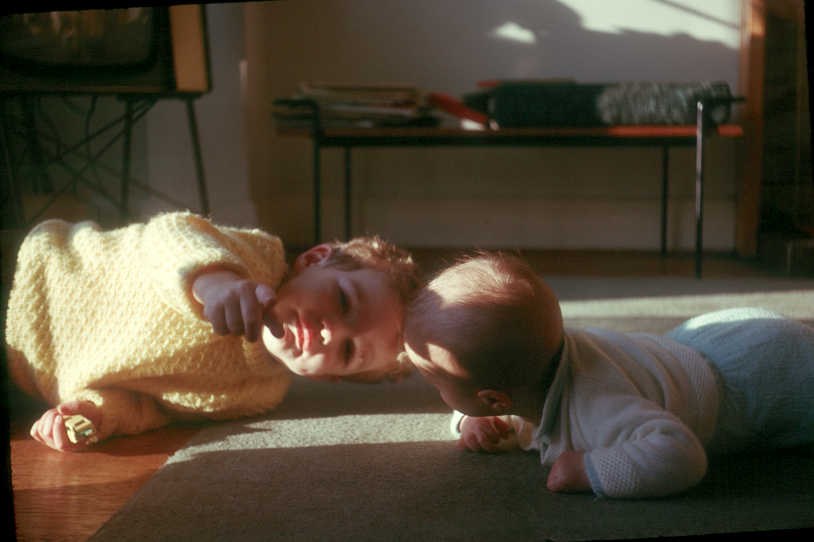 6501021k December 1965 - Simon plays with Jonathan on the living room floor at Hampton.