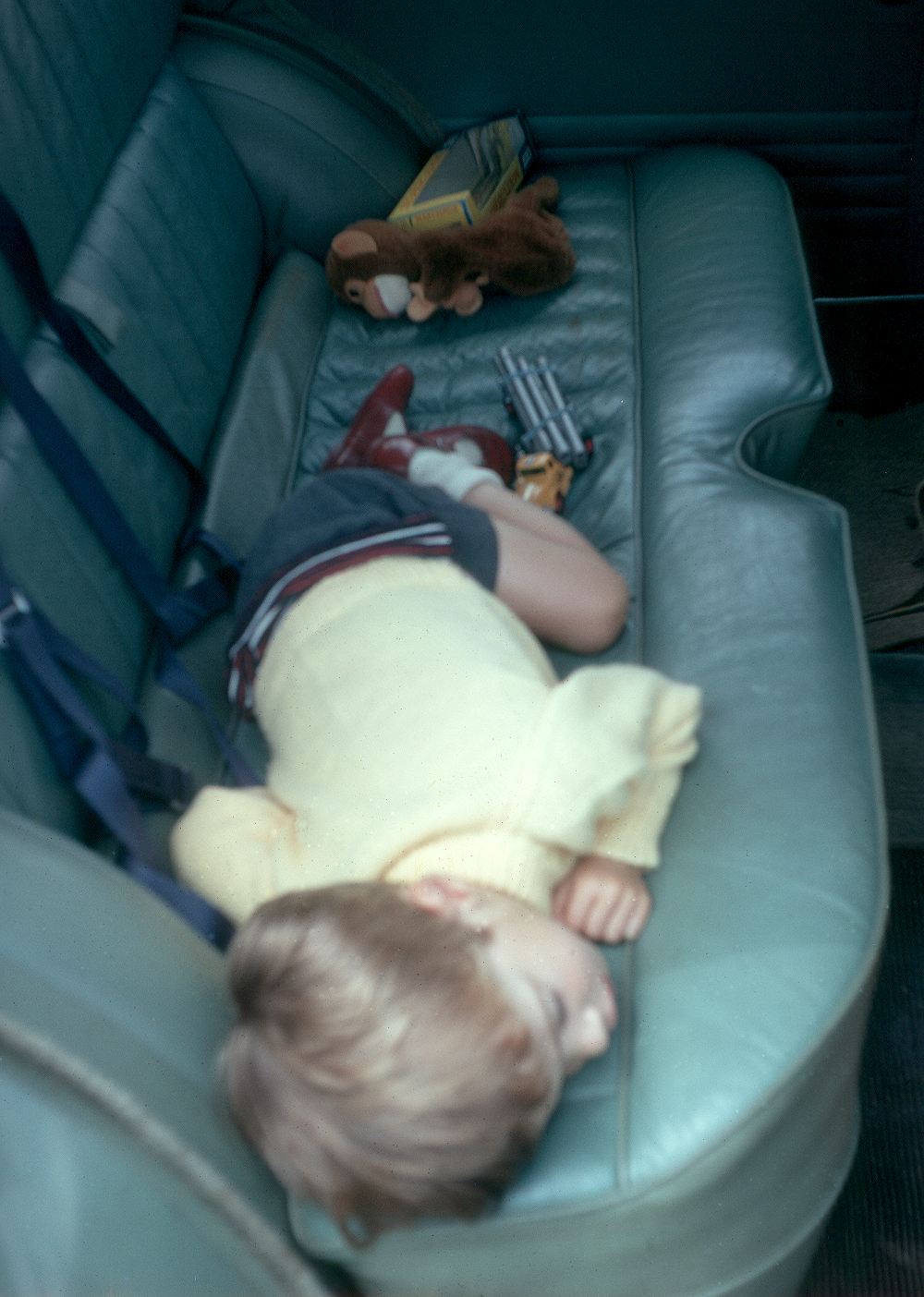 6801801k Summer 1968 - Jonathan asleep in the back of the Austin Cambridge.