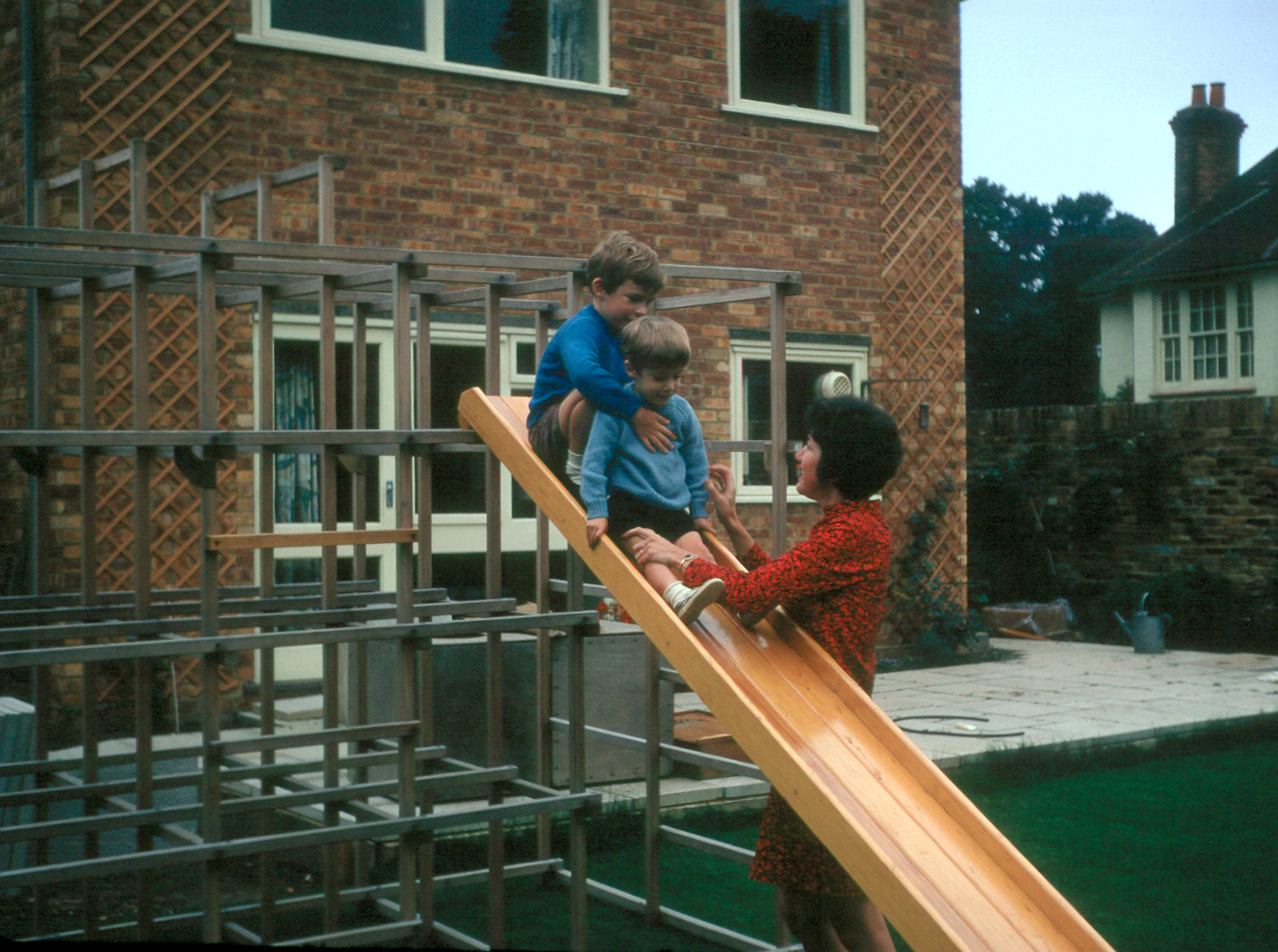 6801814k Summer 1968 - Betty with the boys on the slide at Bracknell.