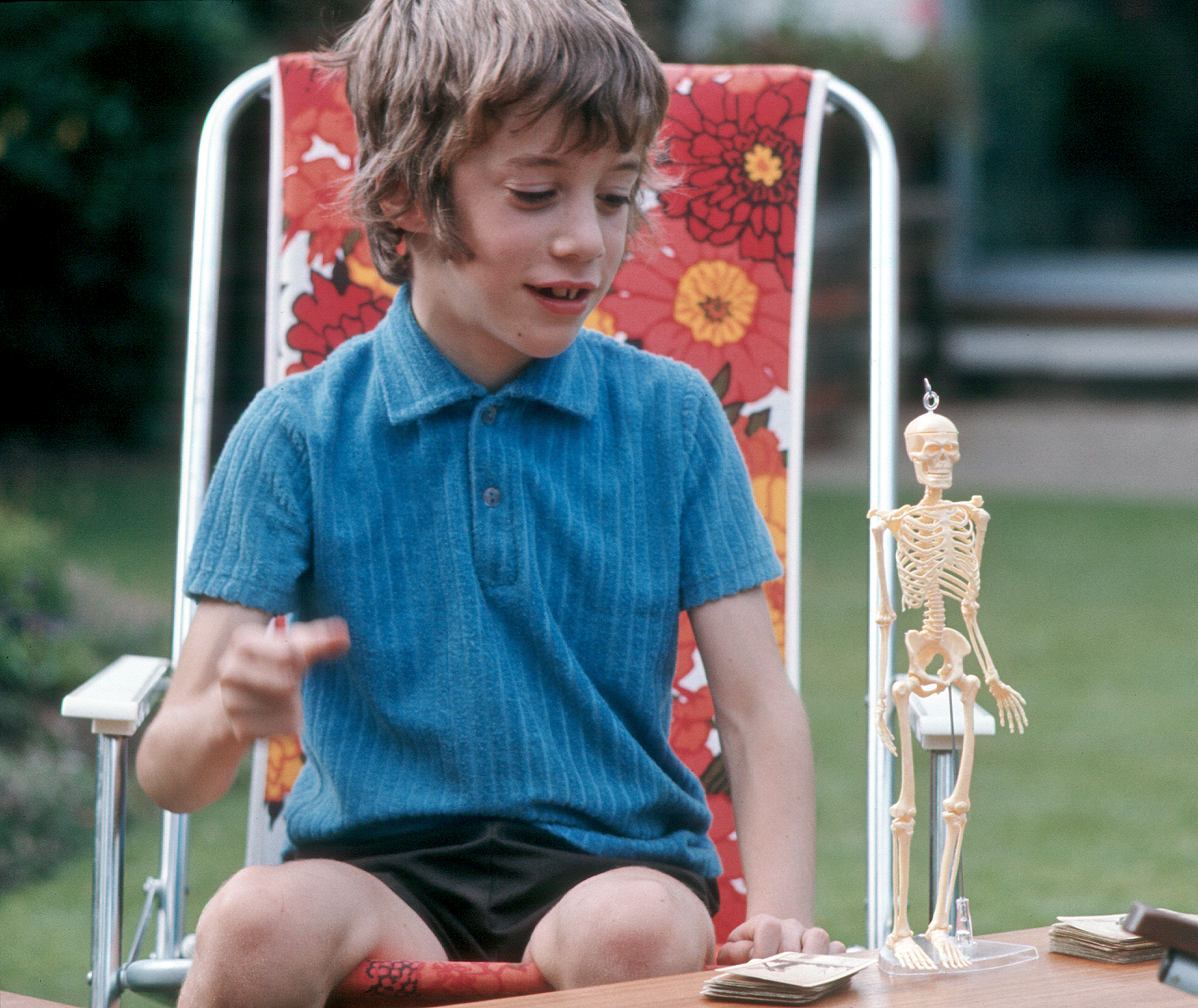 7303609k1 May 1973 - Jonathan with a toy skeleton at Hampton.