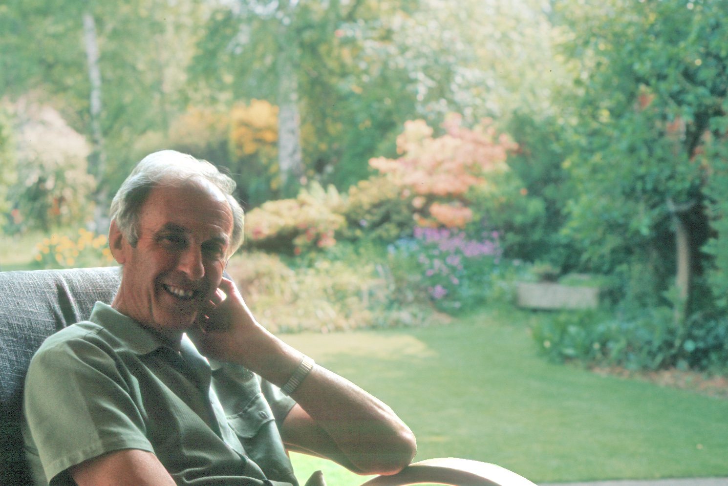 7303615k1 Dad in the sitting room. His garden was at its best at this time of year!