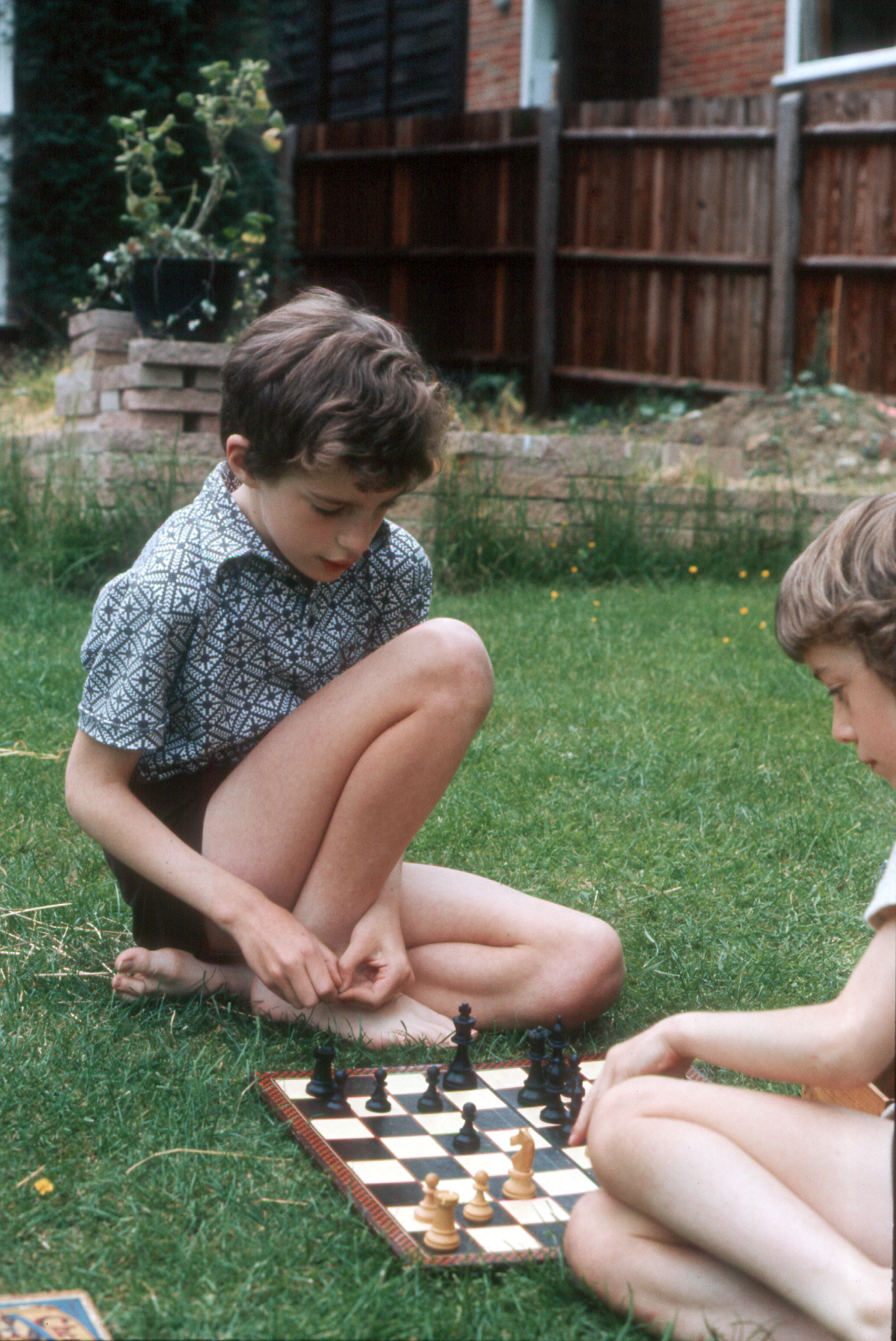 7303622k May 1973 - Simon and Jonathan enjoying a game of chess