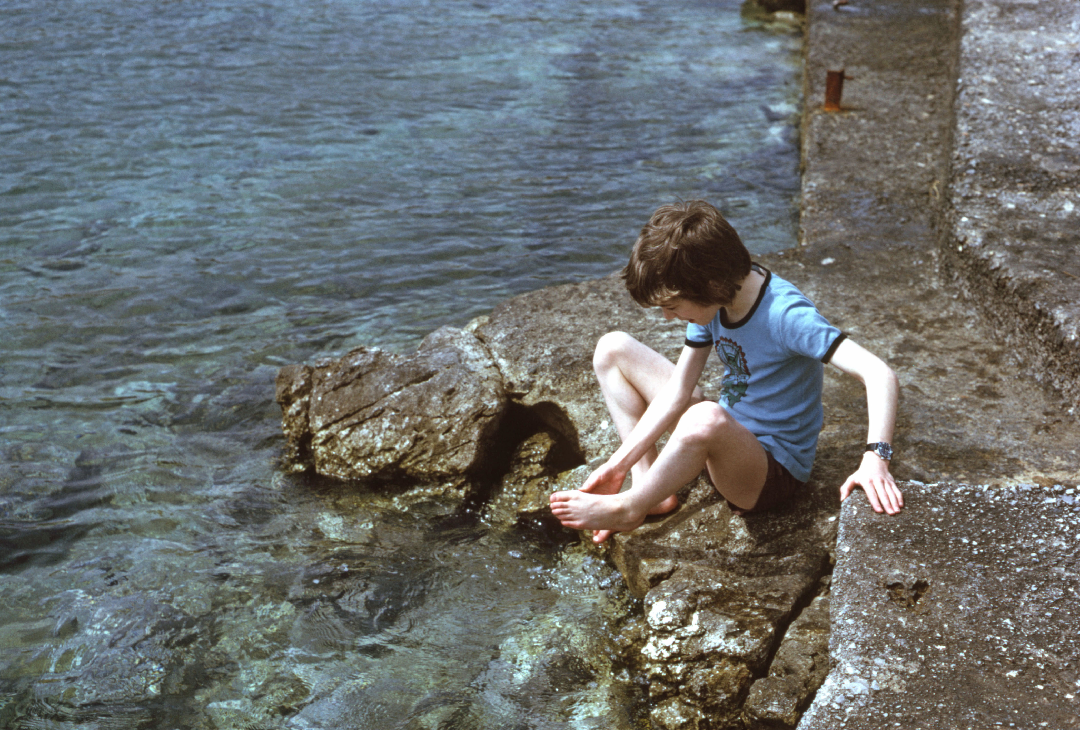 7504808 April 1975 - Jon rinsing his feet in the sea