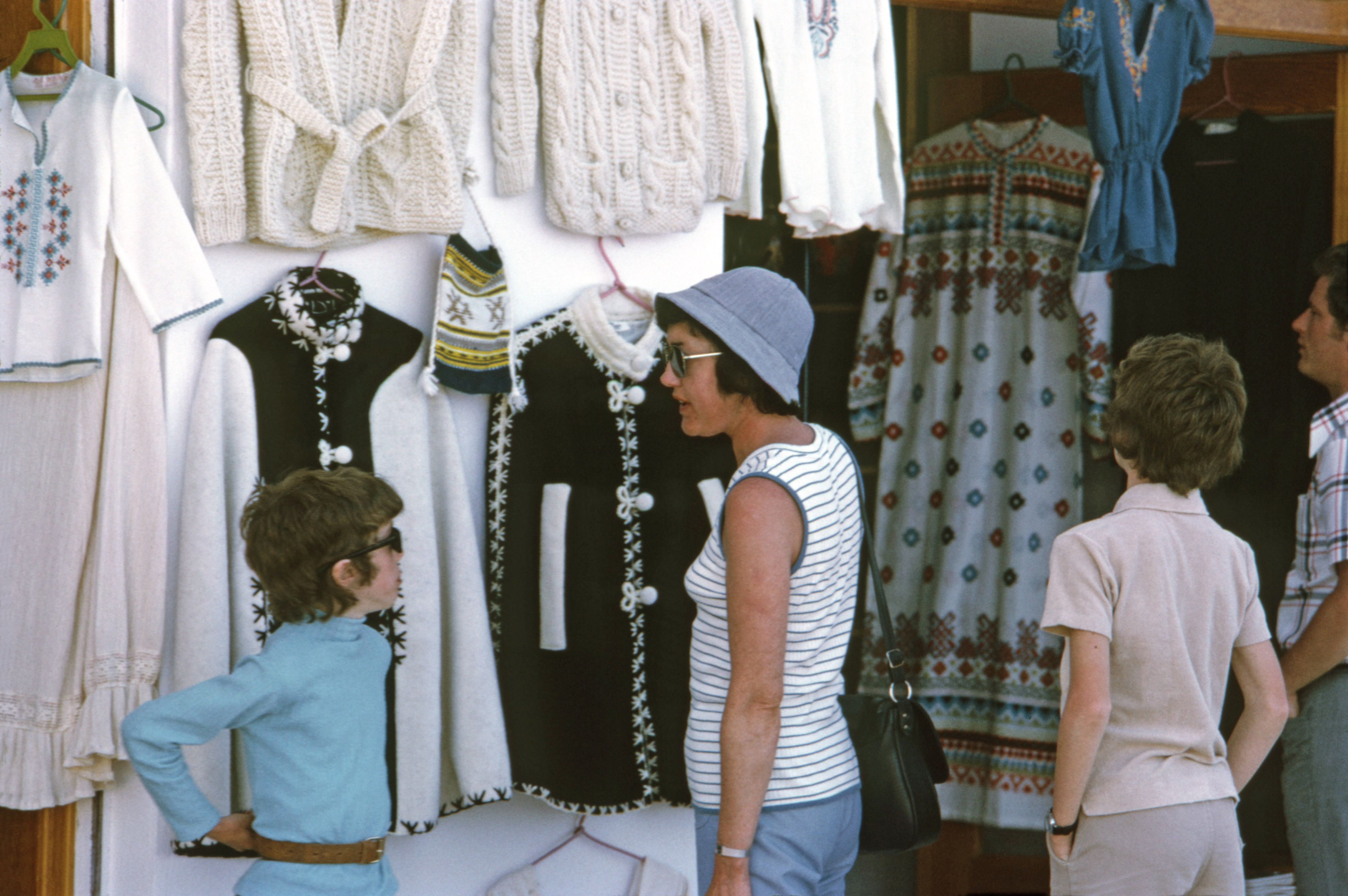 7504927 April 1975 - Elizabeth looking at the clothes in a local shop.