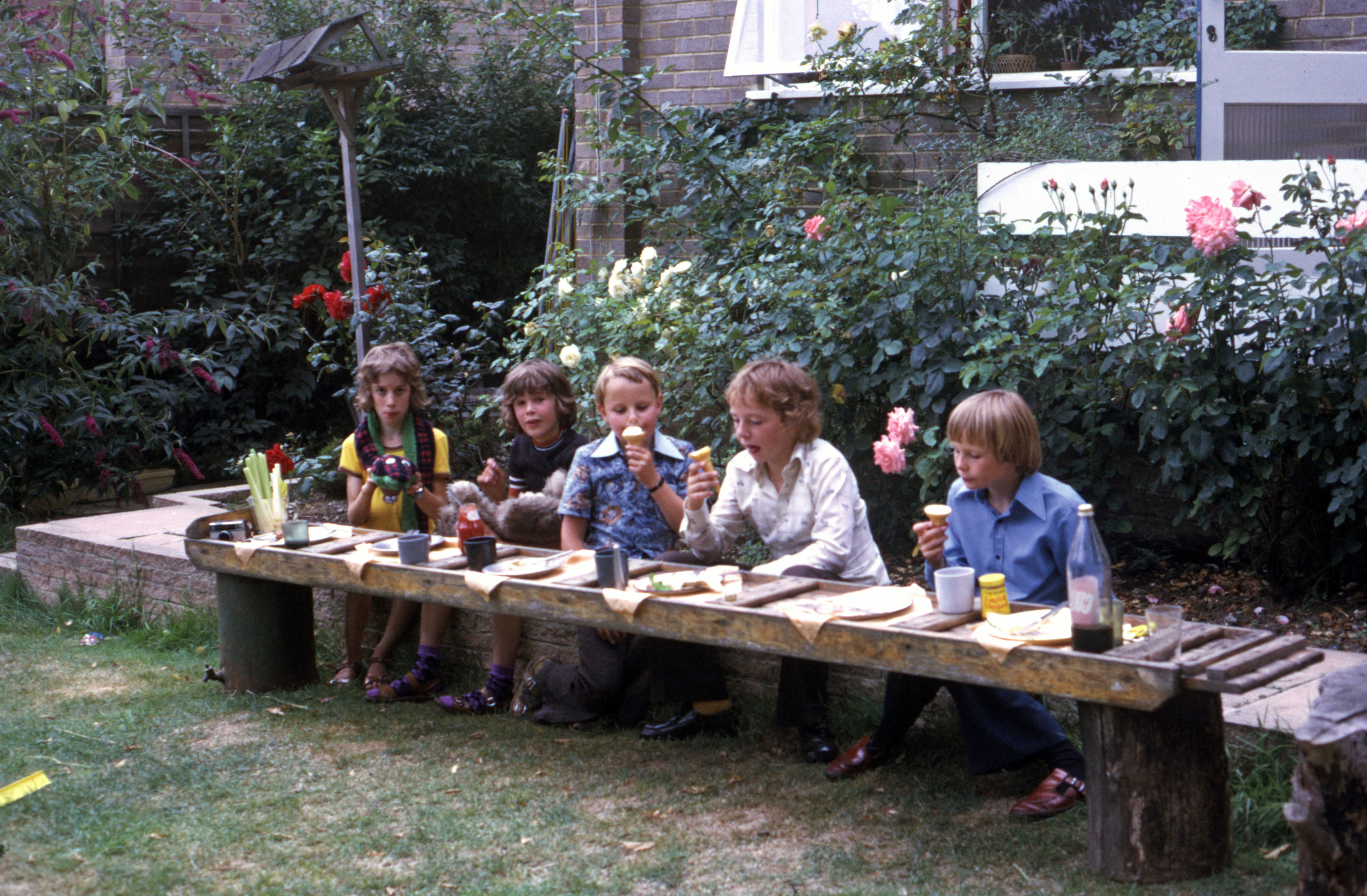 7505321 August 1975 - Jonathan has his birthday tea outside today.