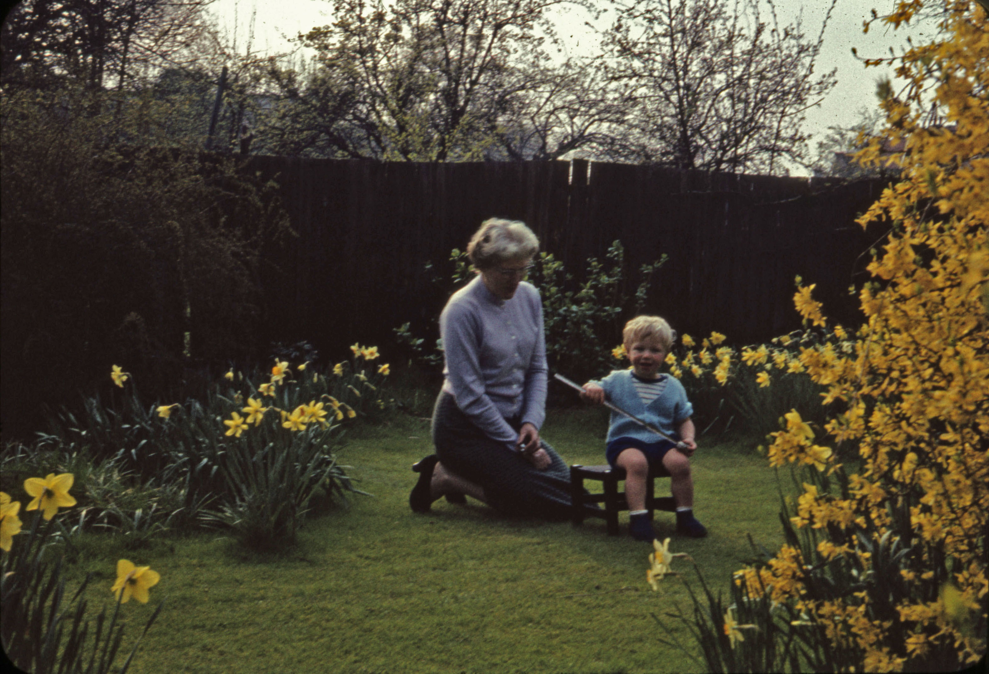 March 1961 Joan with Peter, who is now 17 months, in the garden at Hampton