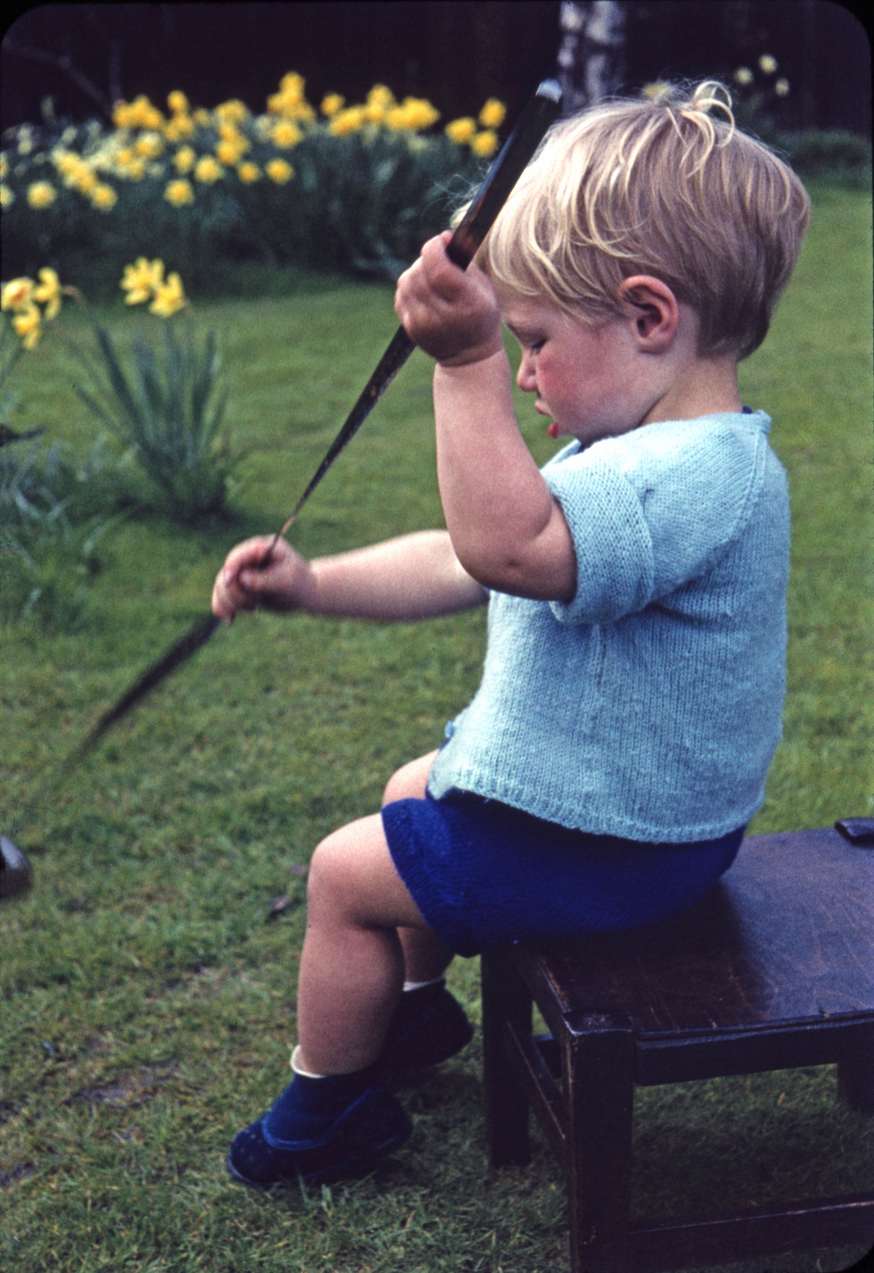 March 1961 Peter playing with a metal ruler (17 months)