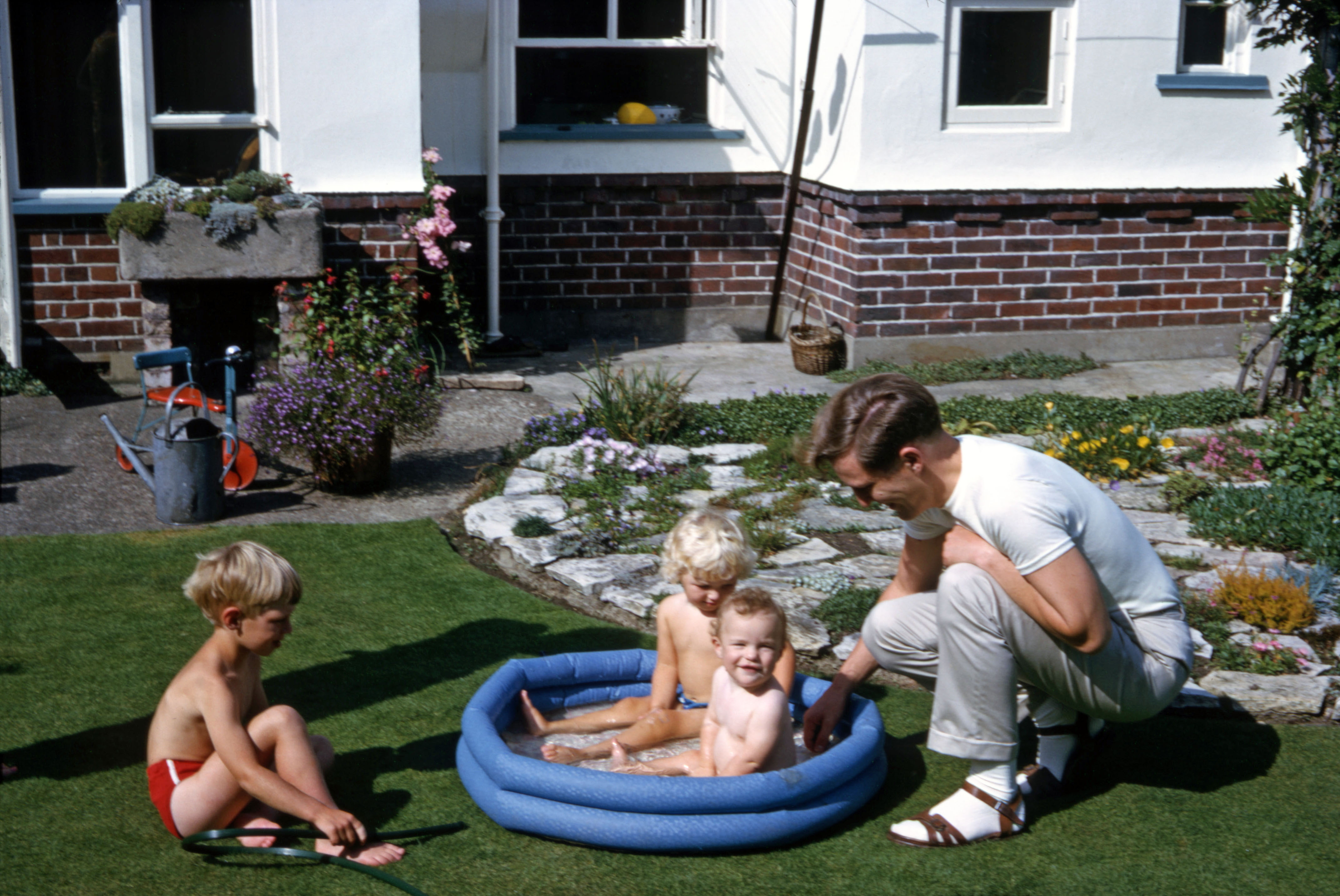 9 Aug 1964 Malcolm and Peter with Nicola and Simon in the pool at Hampton