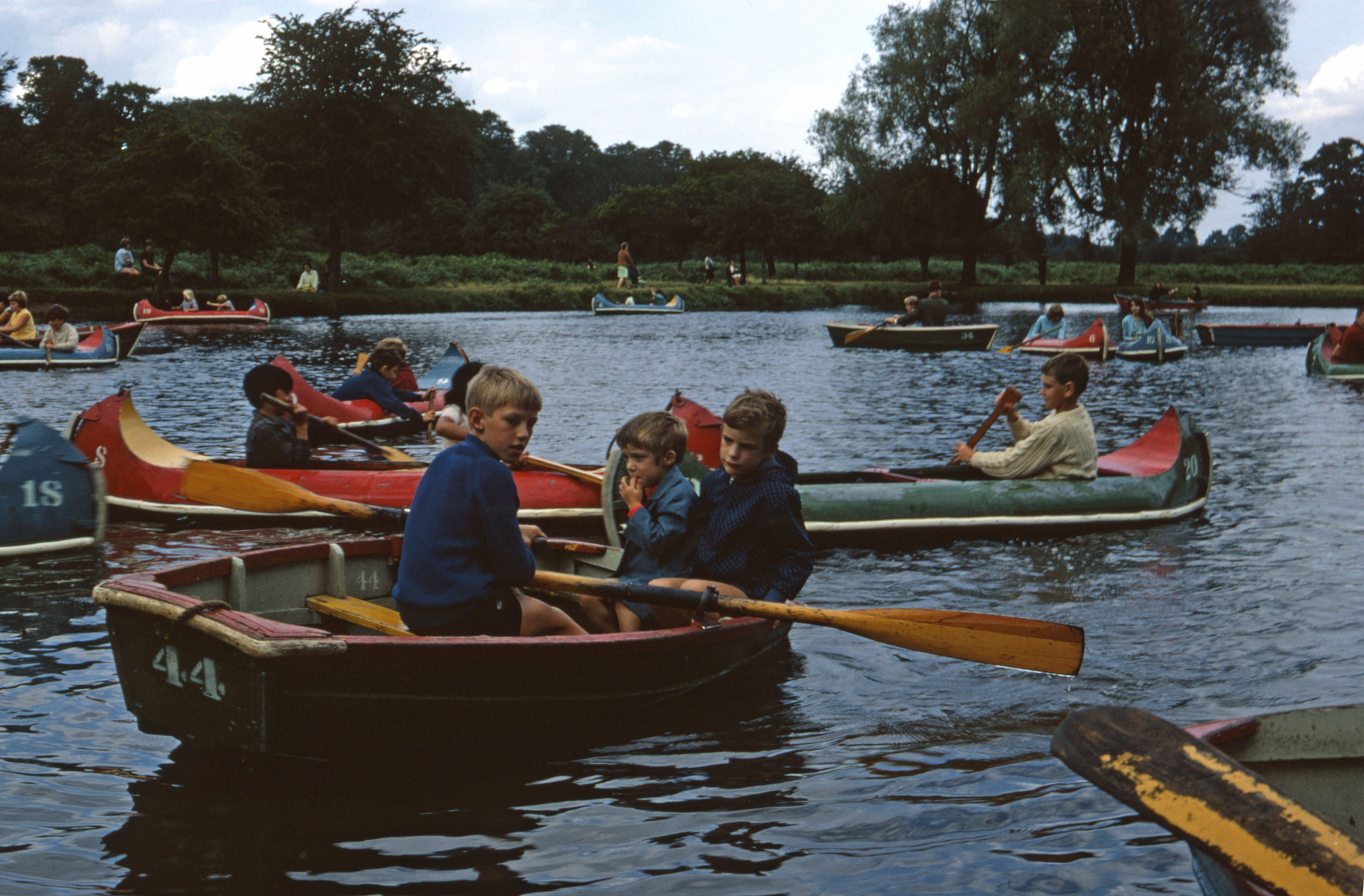 30 Aug 1969 Peter rows Simon and Jonathan on the lake in Bushy Park.